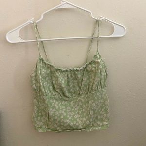 Flower crop top fits perfectly! From Pacsun.